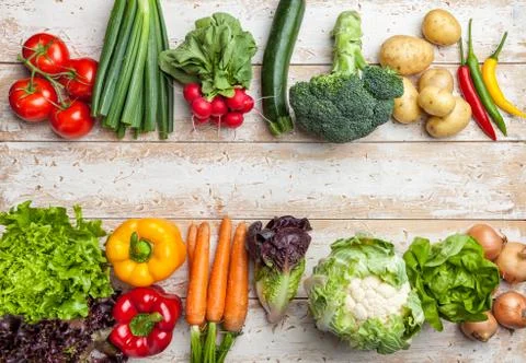 Fresh organic vegetables on rustic background Stock Photos