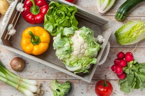Fresh organic vegetables on rustic background Stock Photos