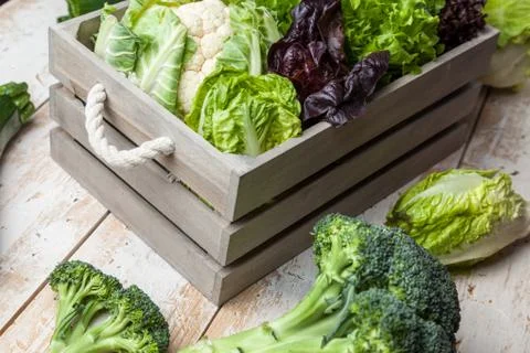Fresh organic vegetables on rustic background Stock Photos