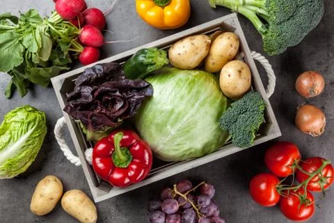 Fresh organic vegetables on rustic background Stock Photos