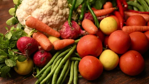 Fresh Organic Vegetables On Table - Tomatoes - Lemon - Cauliflower - Carrot Stock Footage 327514838