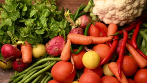 Fresh Organic Vegetables On Table - Tomatoes - Lemon - Cauliflower - Carrot Stock Footage 327514905