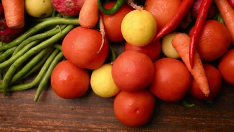 Fresh Organic Vegetables On Table - Tomatoes - Lemon - Cauliflower - Carrot Stock Footage 327515059