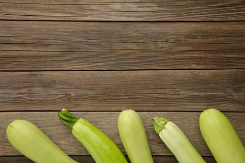 Fresh organic zucchini on the grey wooden table. Fresh squash Stock Photos