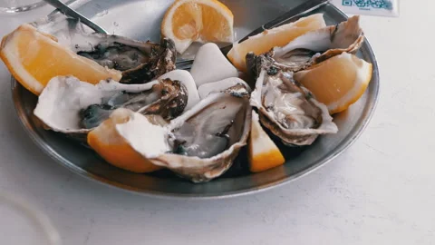 Fresh Oysters with Lemon Stock Footage 293244415