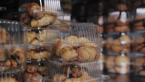 Fresh Packaged Pastries on Store Shelf, Ready to Buy. Bakery production Stock Footage 321808619