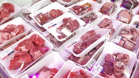 Fresh Packaged Raw Meat or Beef Cuts Displayed in a Supermarket Stock Photos