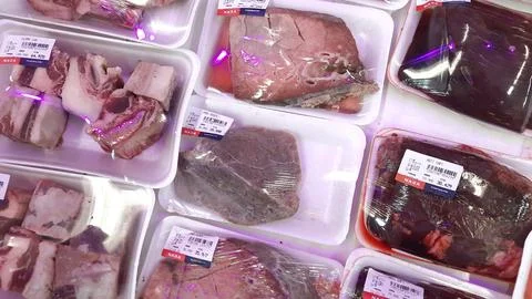 Fresh Packaged Raw Meat or Beef Cuts Displayed in a Supermarket Stock Photos