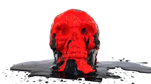 Fresh paint dripping over a human skull with colors pouring and white background Stock Footage 116690884