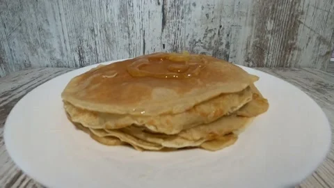Fresh pancakes on a white plate Stock Footage 156312237