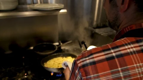 Fresh pasta being cooked in a pan in a restaurant kitchen. 스톡 동영상 96478190
