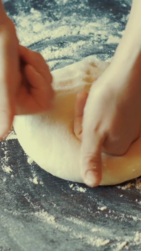 Fresh pasta dough made from simple ingredients, rolled out to perfection for Stock Footage 287538567