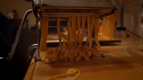 Fresh Pasta Falling Onto Table After Being Cut Stock Footage 97276987