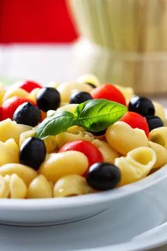 Fresh Pasta Salad with Tomatoes and Black Olives. High quality photo Foto stock
