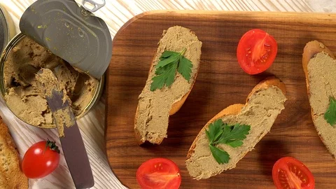 Fresh pate with bread on wooden table Stock Footage 74720619