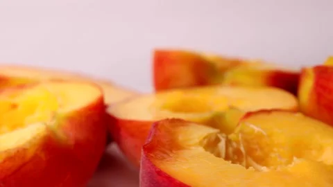 Fresh peach halves, rotation in circle. Fresh organic fruit, Turning Stock Footage 277576865