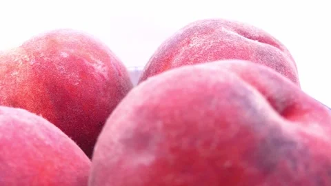 Fresh peaches rotating in deep plate on white background 스톡 동영상 344052691