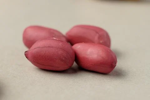 Fresh peanuts resting on a surface ready for cooking or snacking Stock Photos