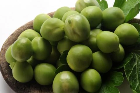 Fresh peas in the spoon Stock Photos