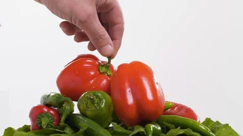 Fresh peppers on a plate Stock Footage 99390073