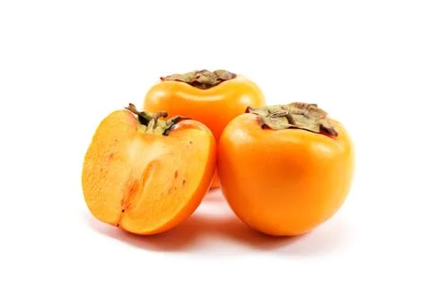 Fresh persimmon fruit isolated on white background. Stock Photos