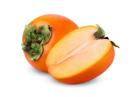 Fresh persimmon fruit with one cut in half, showing orange flesh and green .. Stock Photos