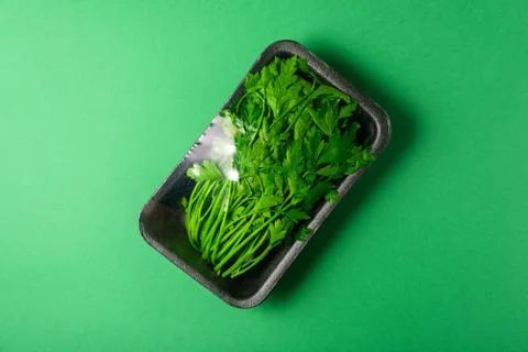Fresh petersell in disposable plastic package Stock Photos