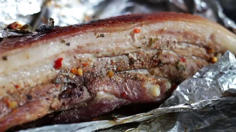 Fresh piece of freshly cooked bacon with spices Stock Footage