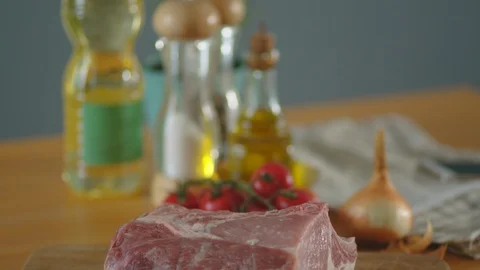Fresh piece of meat on the kitchen table Stock Footage 125167693