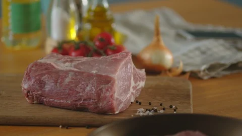 Fresh piece of meat on the kitchen table Stock Footage 125167962