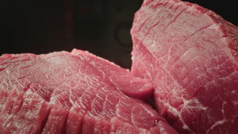 Fresh piece of raw red meat. Close-up macro shot of a fillet texture. Camera on Stock Footage 239677900