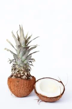 Fresh pineapple and coconuts on white background Stock Photos
