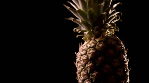Fresh pineapple on black background. Rotating Footage of a fruit Stock-Footage 149997280
