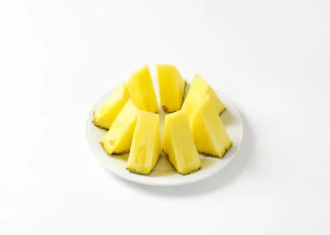 Fresh pineapple chunks on a plate Stock Photos