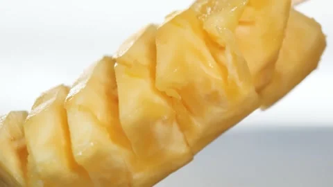 Fresh Pineapple Chunks on a Wooden Skewer Close Up Stock Footage 345651084