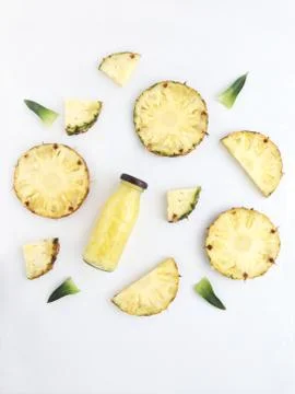 Fresh pineapple drinks and pineapple slices with leaves Stock Photos