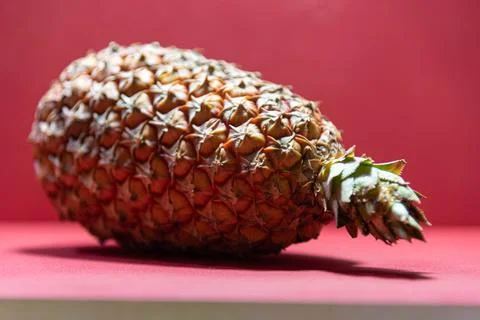Fresh pineapple fruit on red background Stock Photos