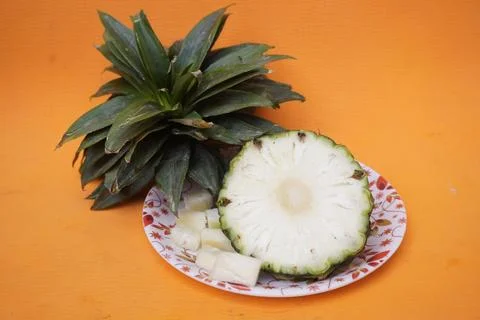 Fresh pineapple fruit with a refreshing smoothie, vibrant tropical drink Фото
