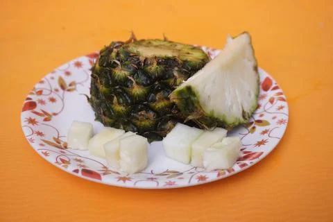 Fresh pineapple fruit with a refreshing smoothie, vibrant tropical drink 库存照片