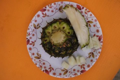 Fresh pineapple fruit with a refreshing smoothie, vibrant tropical drink Fotos de archivo