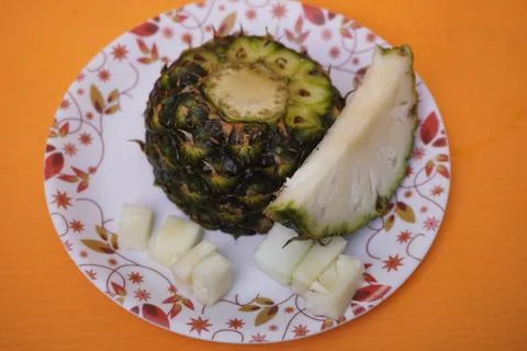 Fresh pineapple fruit with a refreshing smoothie, vibrant tropical drink Photos
