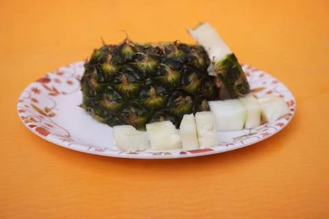 Fresh pineapple fruit with a refreshing smoothie, vibrant tropical drink Фото