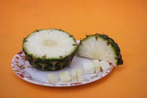 Fresh pineapple fruit with a refreshing smoothie, vibrant tropical drink Photos