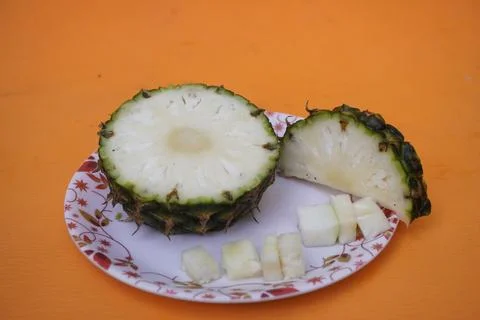 Fresh pineapple fruit with a refreshing smoothie, vibrant tropical drink Фото