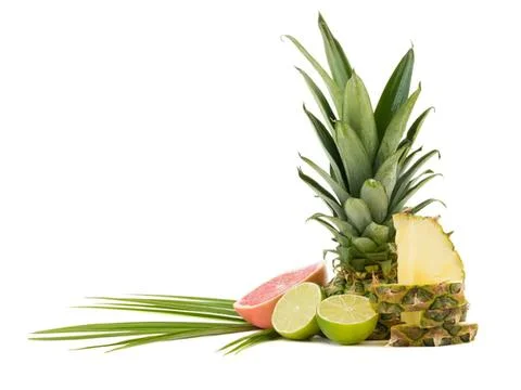 Fresh pineapple, lime, and fruit slices on white background 写真素材