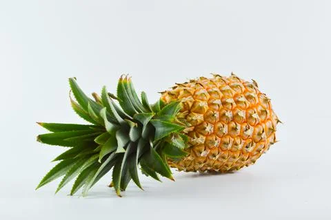 Fresh pineapple over white background. Tropical fruit. Stock Photos