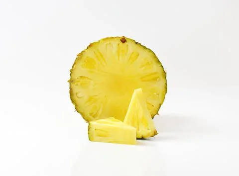 Fresh pineapple slice on clean surface Stock Photos