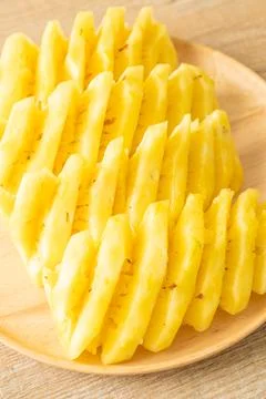 Fresh pineapple sliced on plate Stock Photos