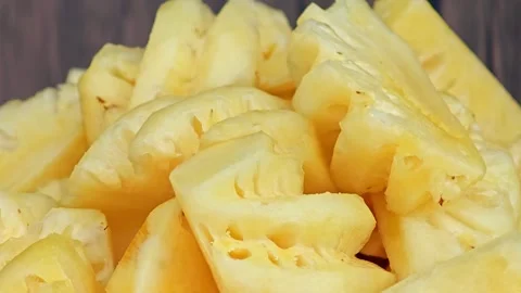 Fresh pineapple slices, zoom in. Stock Footage 306989922