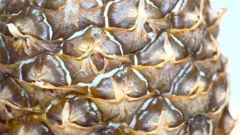 Fresh pineapple spinning on black background Video stock 100631702